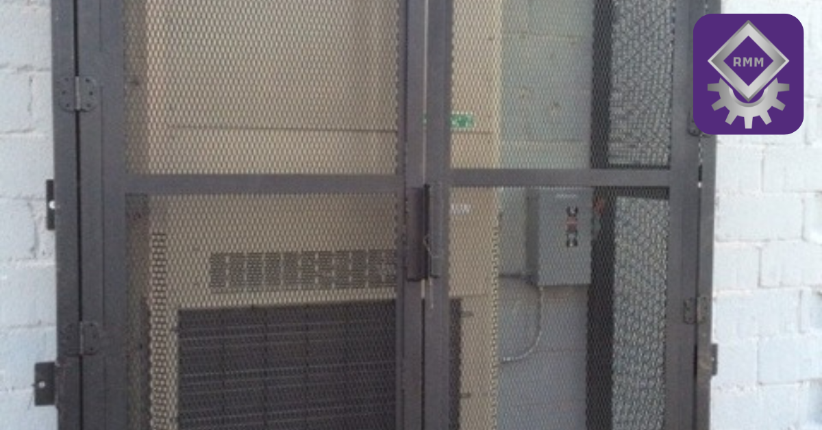 Heavy duty industrial steel HVAC security cage enclosing commercial outdoor mechanical equipment