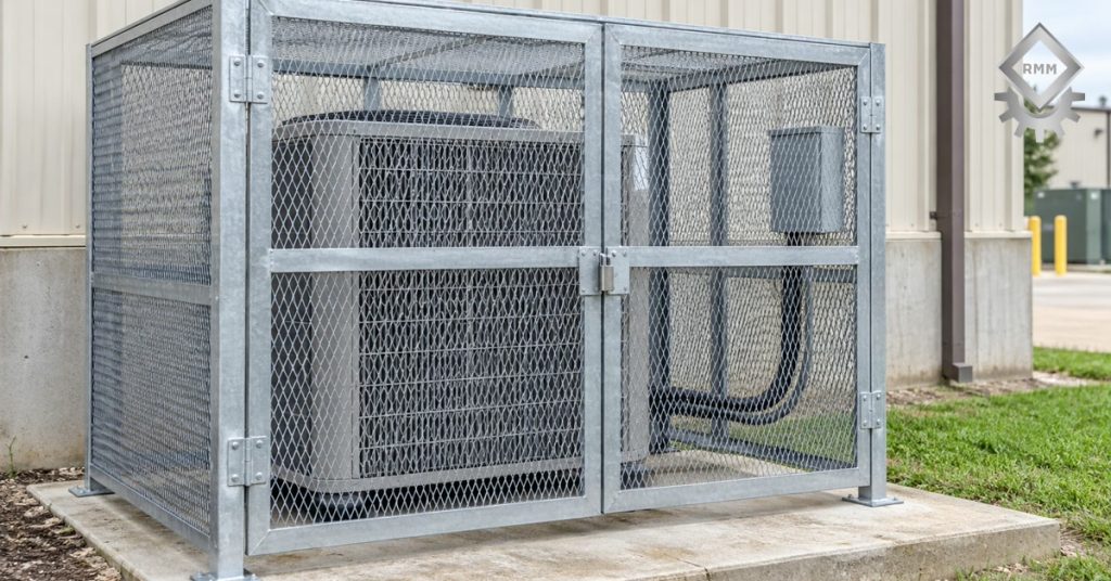 Galvanized steel security cage anchored over a commercial HVAC condenser